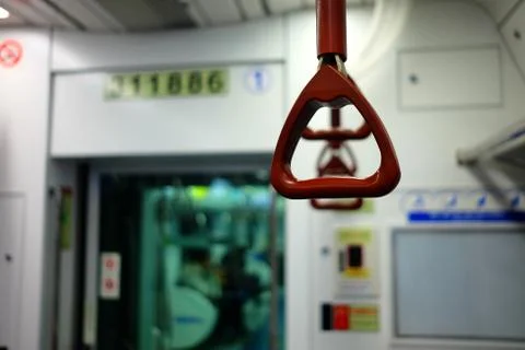 Handle Hanging in Ceiling Subway. Photos