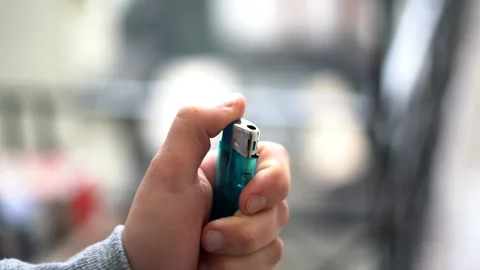 Handle lighters on light blurry background, day Stock Footage 159426673