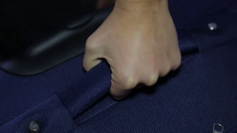 Handle of luggage in a woman's hand Stock Footage 80956361