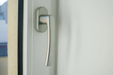 Handle of a metal-plastic window close up. Repair and construction at home,.. 스톡 사진