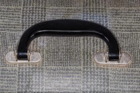 Handle of the old hardshell suitcase close-up Stock Photos