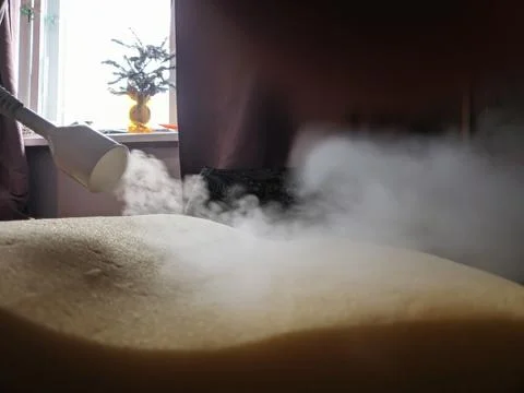 Handle the steam with the help of a pair of bedding pillows. Desinsection of the Stock Photos