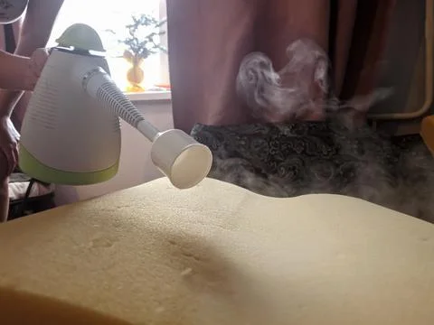 Handle the steam with the help of a pair of bedding pillows. Desinsection of the Stock Photos