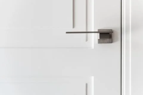 Handle of a white door Stock Photos