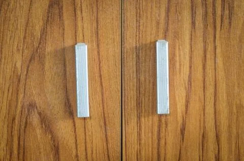 Handle  on wood background Stock Photos
