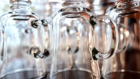 Handled Glasses in Noisy Room Stock Footage 289879741