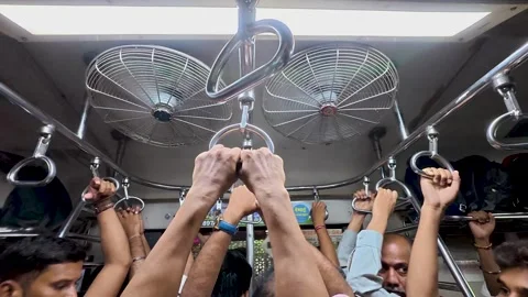 Handles and rails inside a crowded Mumbai local train Stock Footage 336705012