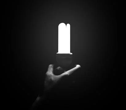 Handles light bulb on black background Photos