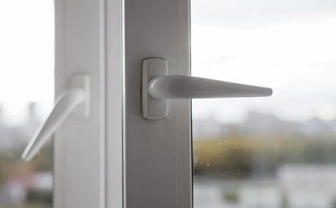 Handles opened plastic window. Stock Photos