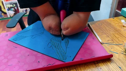 A handless worker cuts patterns on canvas Stock Footage 308798771