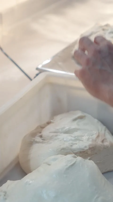 Handling and Weighing Dough During Bakery Preparation Stock Footage 344393174
