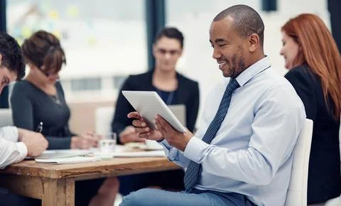 Handling even the most difficult of tasks with ease. a businessman using a Foto stock