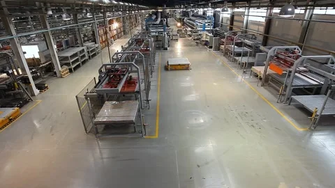 Handling of fired products is done with automatic vehicles. Ceramic tile Video stock 321369988