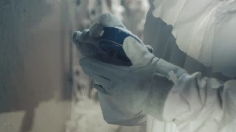 Handling frostcovered sample in storage. Technician carefully moves frostcoated Stock Footage 346474924