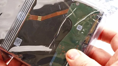 Handling a HDD Hard Disk Drive for Computer Data Storage Stock Footage 304507560
