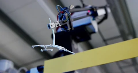 Handling Robot Removing Molded Plastic Part, Overhead Automation, Wide Shot Stock Footage 340663721