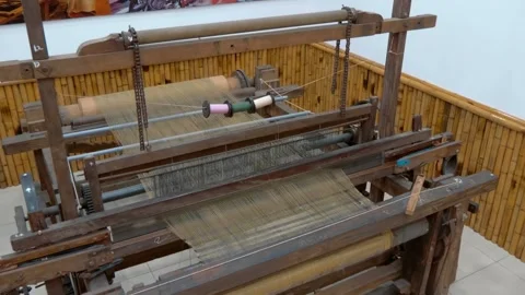 A handloom, a manual device used to craft textiles by interlacing silk threads Stock Footage 333398941