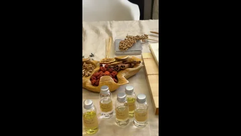 Handmade Aromatherapy Candle Making Process Flat Lay with Dried Flowers and Cera Stock Footage 311148146