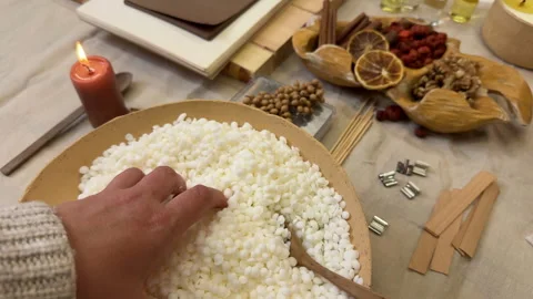 Handmade Aromatherapy Candle Making Process Flat Lay with Dried Flowers and Cera Stock Footage 311149842