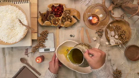 Handmade Aromatherapy Candle Making Process Flat Lay with Dried Flowers and Cera Stock Footage 311150058
