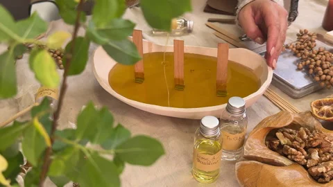 Handmade Aromatherapy Candle Making Process in Ceramic Bowl with Dried Flowers Video stock 311150182