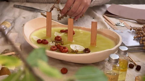 Handmade Aromatherapy Candle Making Process in Ceramic Bowl with Dried Flowers 스톡 동영상 311152357