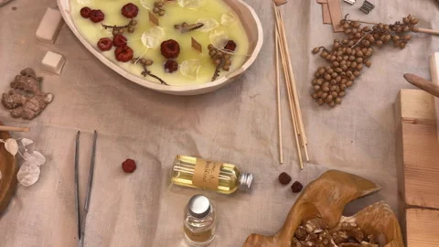 Handmade Aromatherapy Candle Making Process Flat Lay with Dried Flowers and Cera Stock Footage 311172467