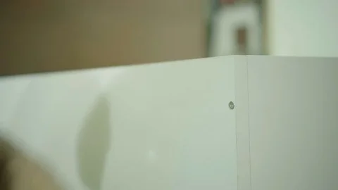 Handmade assembling and fitting Kitchen drawers. Worker twists the screws Stock Footage 77650209
