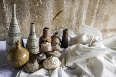 Handmade Assorted Many Different Ceramic Vases on white table. Foto stock