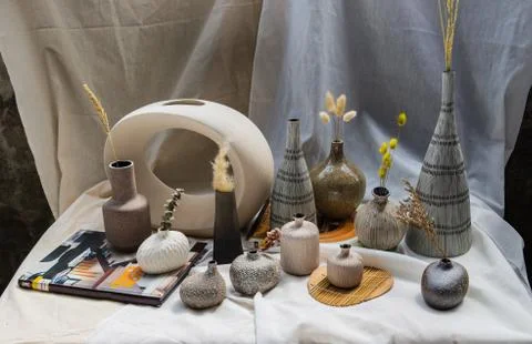 Handmade Assorted Many Different Ceramic Vases on white table. Stock Photos
