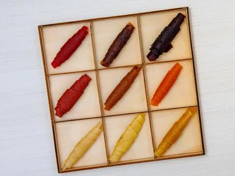Handmade assorted pastille in square box. Set of different fruit paste Stock Photos