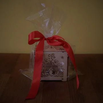 Handmade box wrapped with red bow for Christmas gift Stock Photos