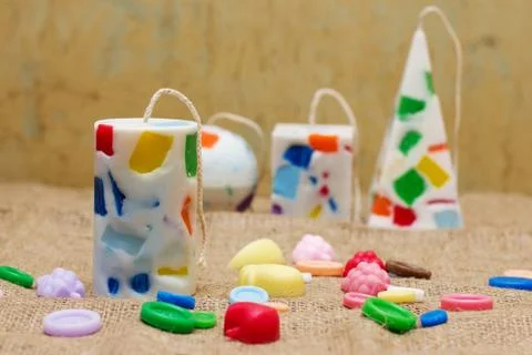 Handmade candles in the shape of a pyramid, cube, cylinder and sphere Stock Photos