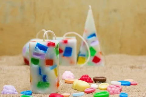 Handmade candles in the shape of a pyramid, cube, cylinder and sphere Stock Photos