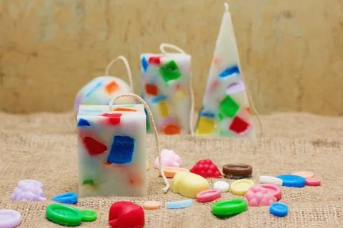 Handmade candles in the shape of a pyramid, cube, cylinder and sphere Stock Photos