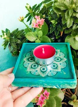 Handmade candlestick with mandala Stock Photos
