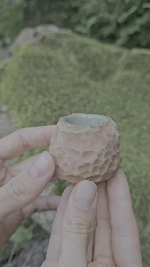 Handmade Ceramic Candle Holder with Textured Surface Video stock 324818961