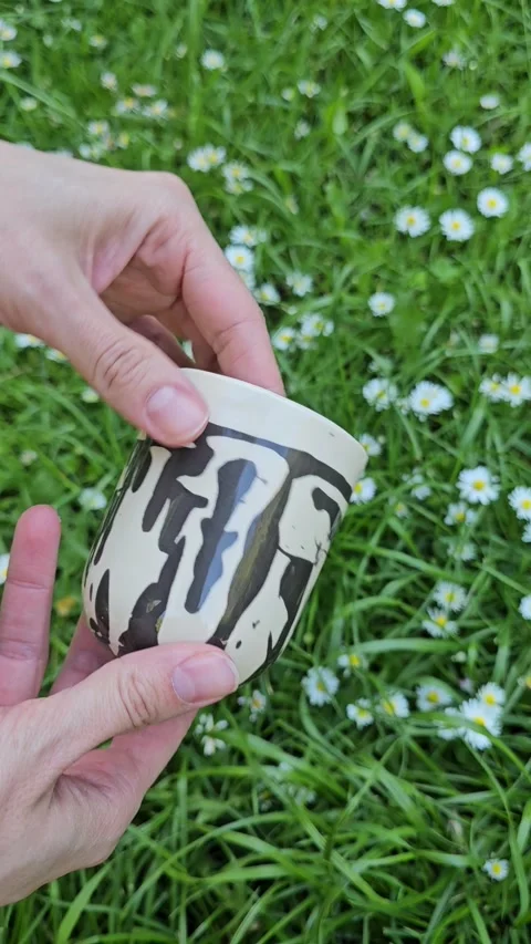 Handmade ceramic cup with abstract pattern rotating view Video stock 324599391