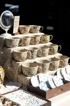 Handmade ceramic cups with floral patterns Stock Photos