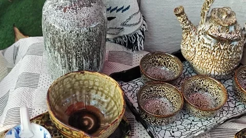 Handmade ceramic tea cups with beautiful crackle glaze on a table. Stock Footage 339779972