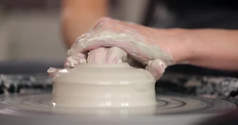 Handmade ceramics concept. Close-up of woman's hands in pottery studio. Cuts the Stock Footage 160423933