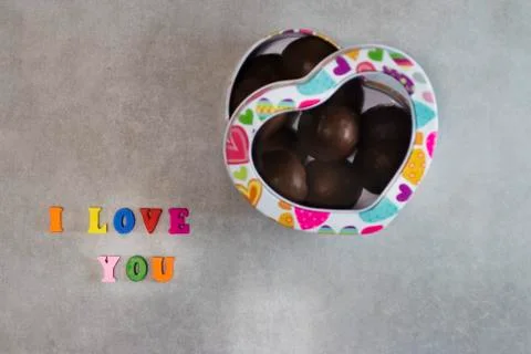Handmade chocolates in a metal box in the shape of a heart Valentine's Day Co Stock Photos