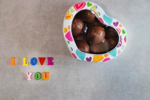 Handmade chocolates in a metal box in the shape of a heart Valentine's Day Co Stock Photos