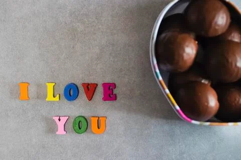 Handmade chocolates in a metal box in the shape of a heart Valentine's Day Co Stock Photos