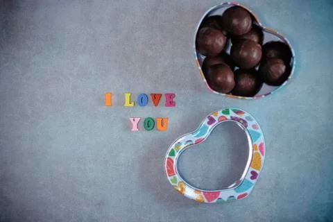 Handmade chocolates in a metal box in the shape of a heart Valentine's Day Co Stock Photos