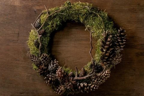 Handmade Christmas holidays wreath with moss and cones Stock Photos