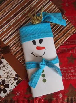 Handmade christmas package for chokolate in the form of a snowman Stock Photos