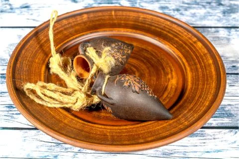 Handmade clay jugs with grape pattern with ropes attached on cl Stock Illustration