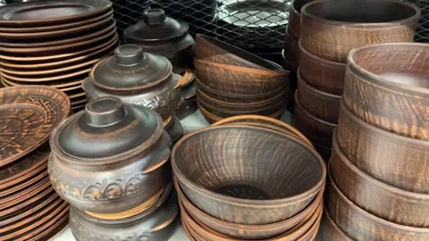 Handmade clay pottery kitchenware collection on shelves Stock Footage 318014184