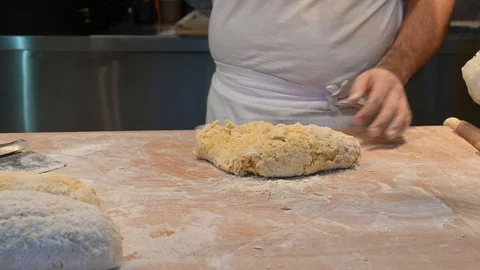 Handmade creation of a dough for gnocchi, typical Italian fresh pasta Stock Footage